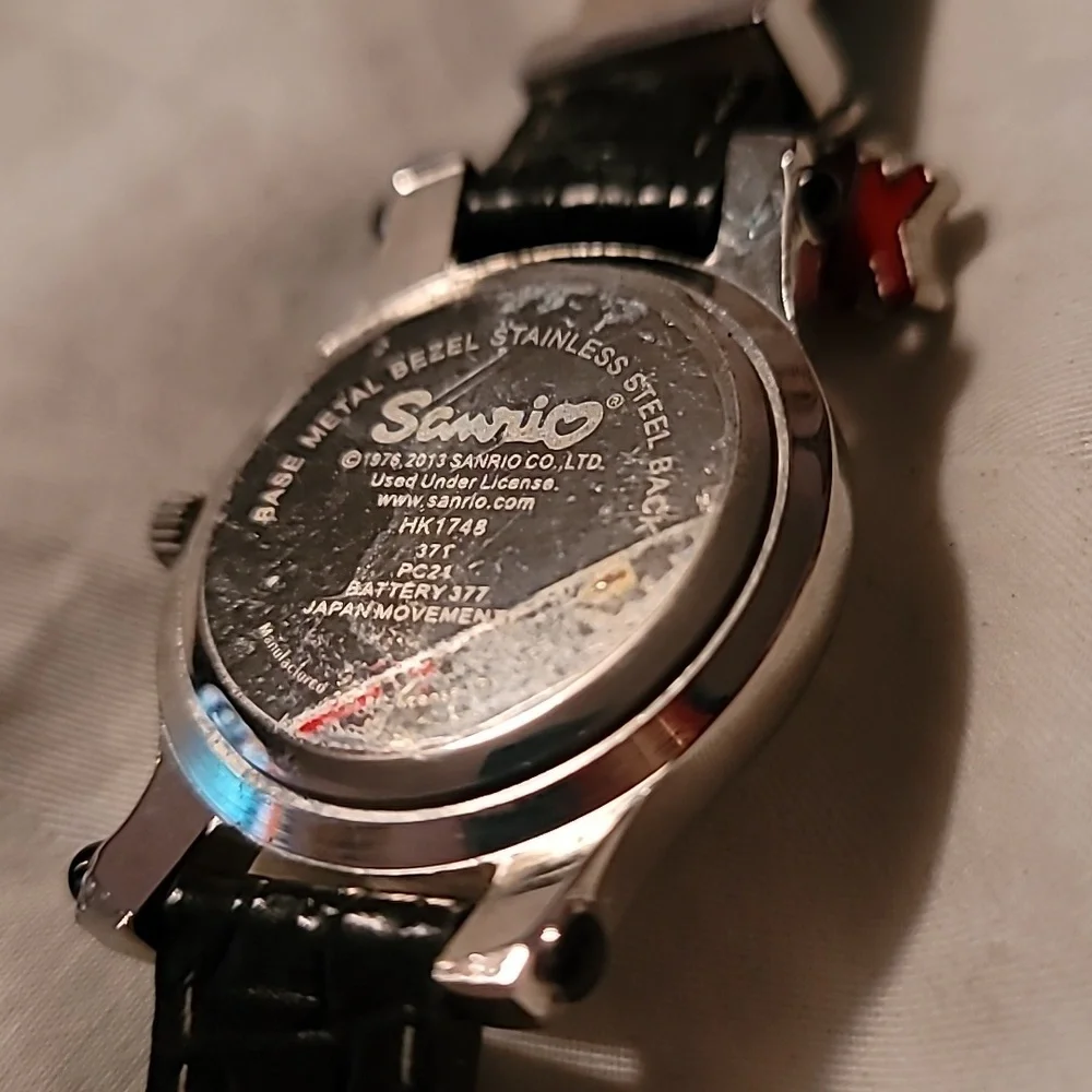 NWOT Sanrio Hello Kitty Womens Charm Quartz Watch Black Leather Band Silver Case